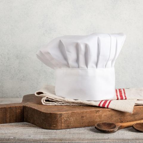 Chef's hat on cutting board