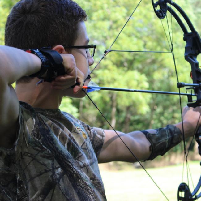 boy drawing bow