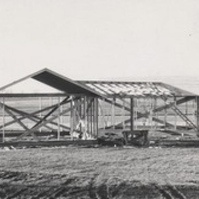 first cabins at camp being built