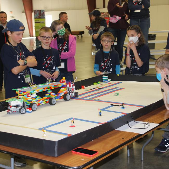 youth at a robotics table