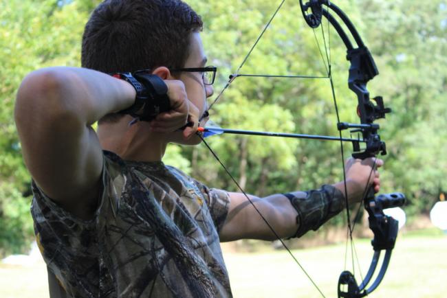 boy drawing bow