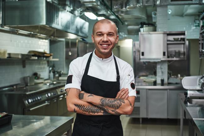 chef standing in empty kitchen