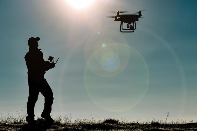 man flying a drone