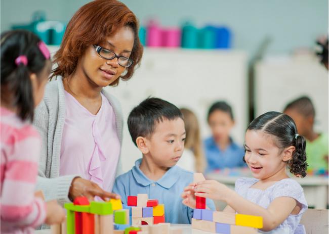 teacher working with preschool kids