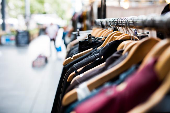 clothes on hangers on a store rack